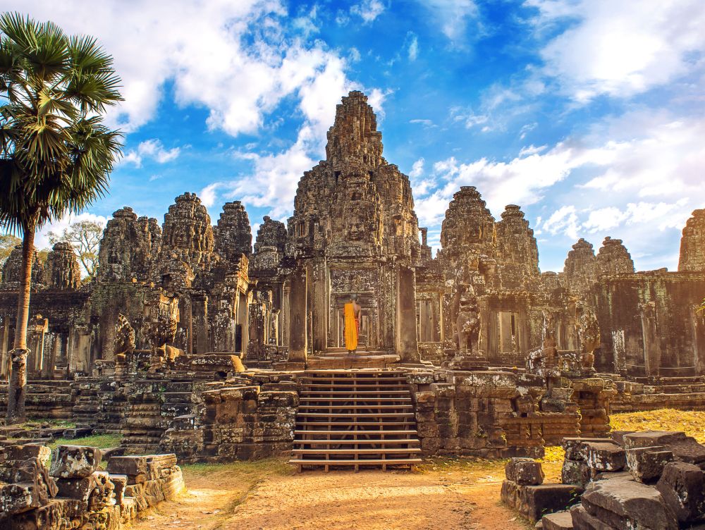 Ancient stone faces at sunset of Bayon temple, Angkor Wat, Siam Reap, Cambodia.